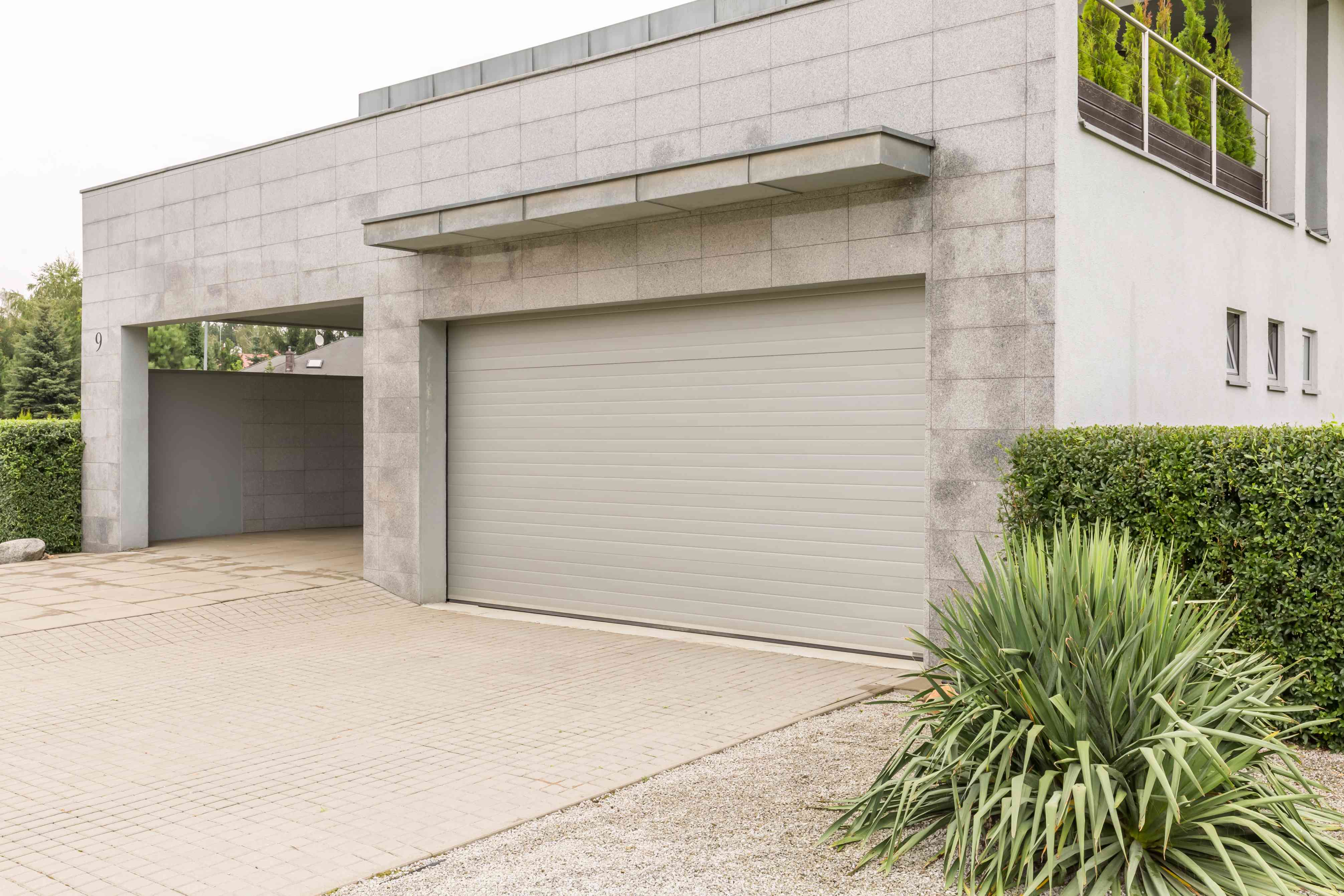 garage-in-big-house-PZYTQ4R(1) How Do You Program a Garage Door Opener?