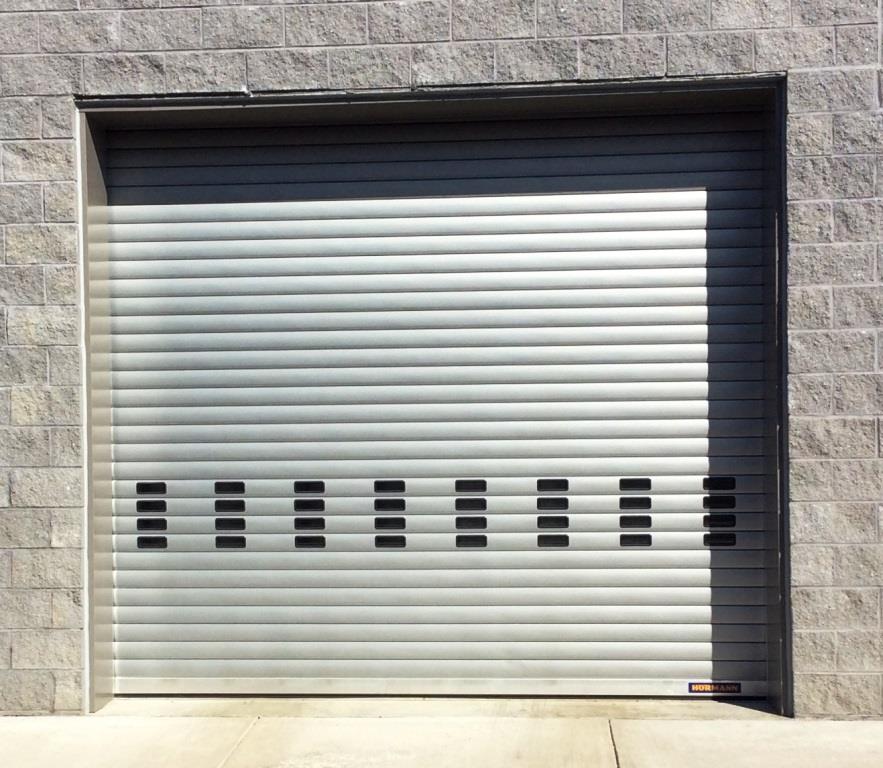 Rolling Steel vs. Sectional Overhead Doors: Which Commercial Door Is Right for Your Building?