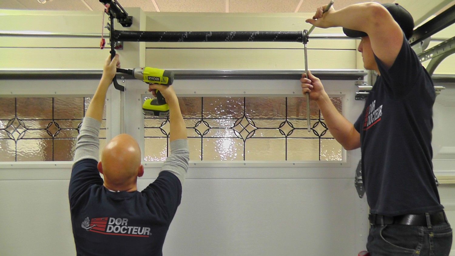 installers-working_dd Is Your Garage Door Calling For Repair? Hire the Professionals Only